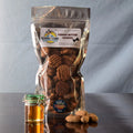 Doggie Style Gourmet Treats peanut butter cookies for dogs, showing fresh, crunchy dog treats on a rustic wooden surface.