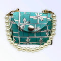 Dog wearing Bark Fifth Avenue Pearl Handle Sniffany Pick Up Bag dog clothes, featuring a stylish design and pearl accents.