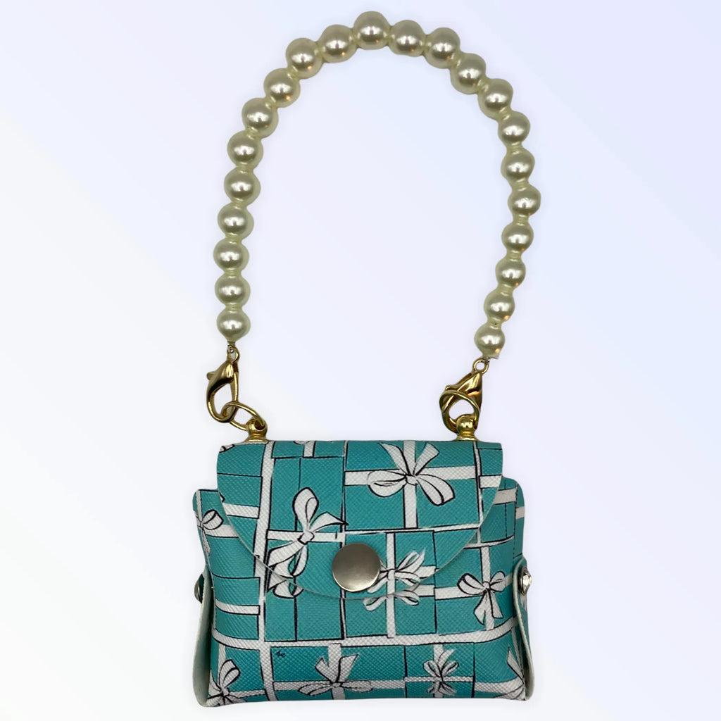 Dog wearing Bark Fifth Avenue Pearl Handle Sniffany Pick Up Bag dog clothes with elegant pearl handle and stylish design.