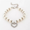 White heart and pearl dog collar by Bark Fifth Avenue featuring a stylish design with pearl accents.