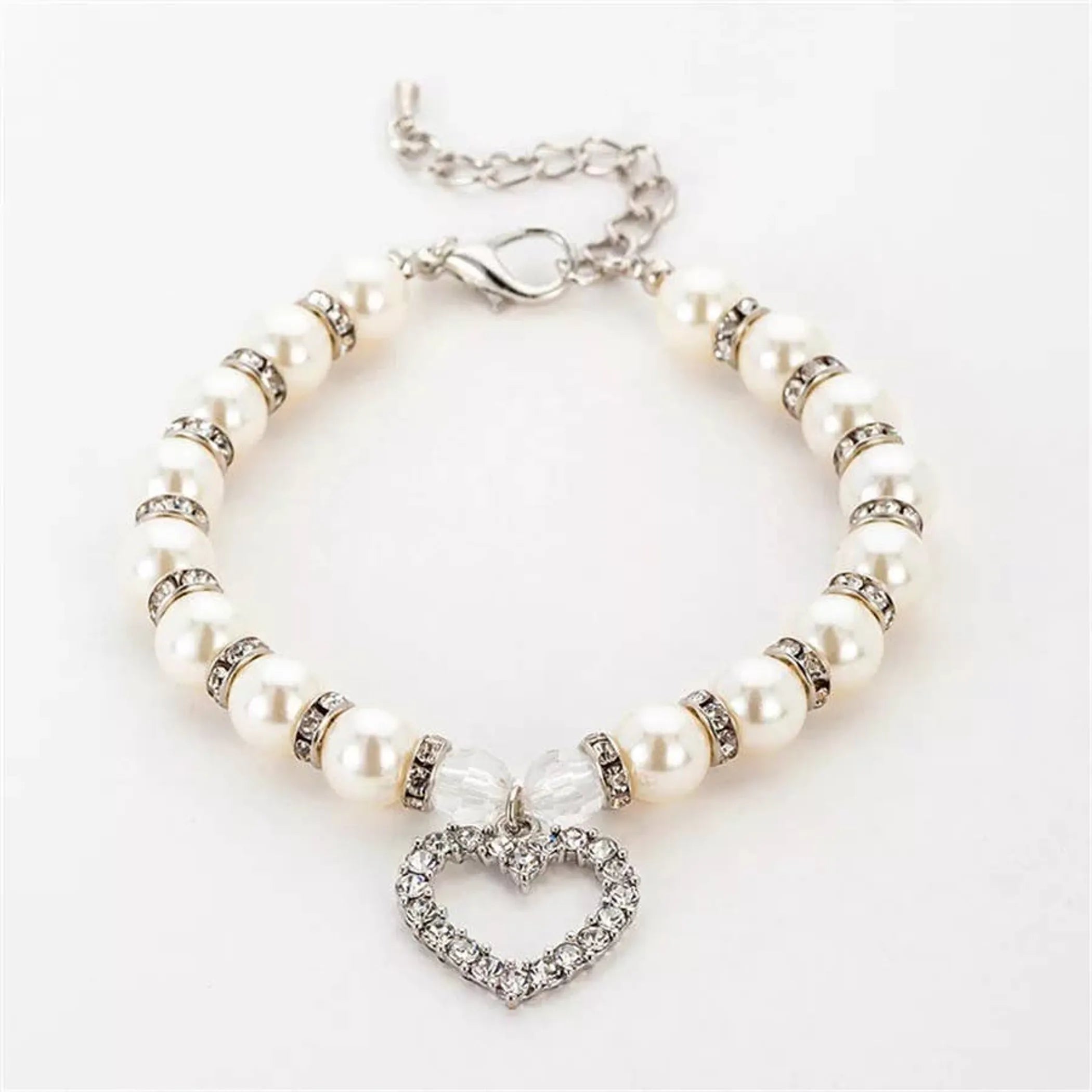 White dog collar with heart and pearl accents by Bark Fifth Avenue, featuring elegant design and adjustable fit.