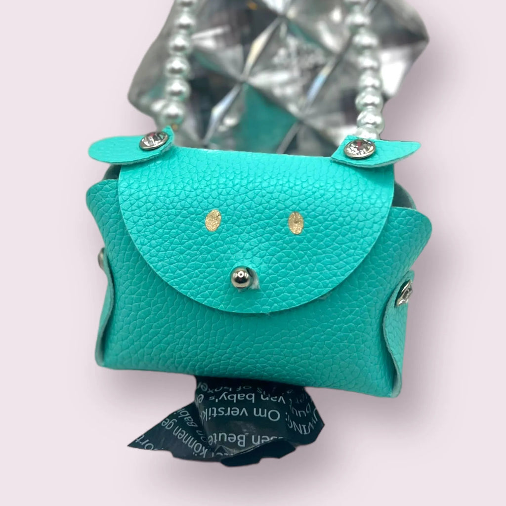 Bark Fifth Avenue Sniffany Puppy Treat Bag Carrier with a stylish design and adjustable clip for easy attachment.