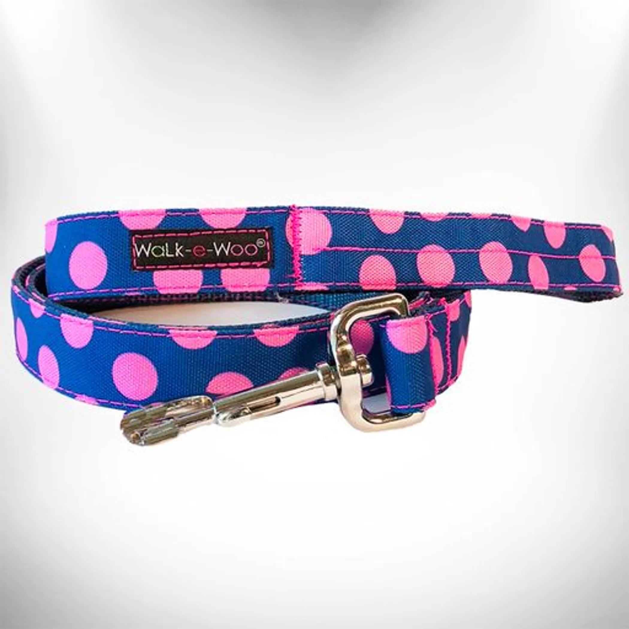 Polka dot dog collar by Walk-e-Woo featuring a colorful polka dot pattern and adjustable strap for a secure fit.