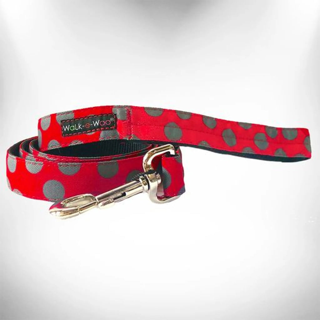 Walk-e-Woo polka dot dog collar with adjustable strap and metal buckle, designed for safe and stylish pet walks.