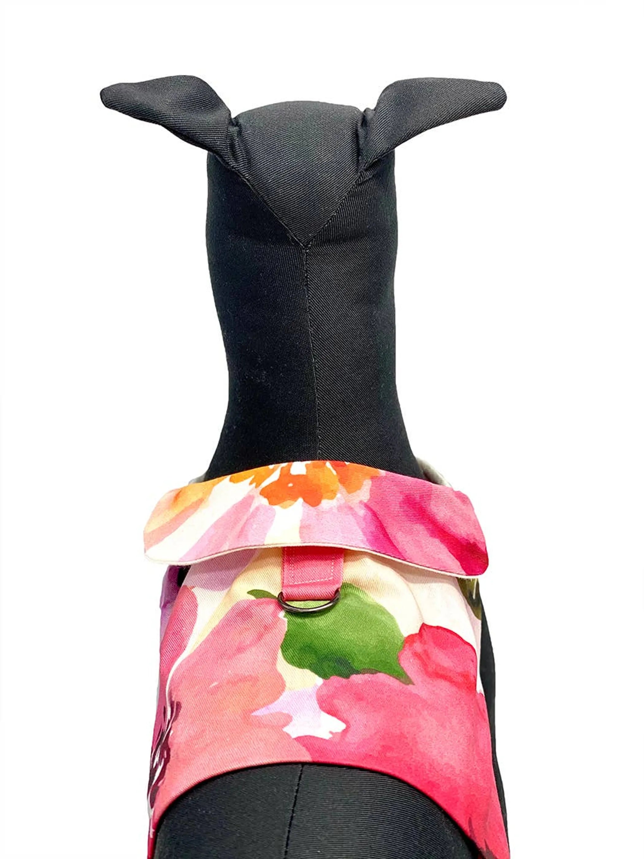 DoggieCoutureNY "Fine Art Frolic" pink vest-style dog harness with adjustable straps and metal D-ring for leash attachment.