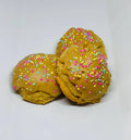 Dog treats shaped like peanut butter cake balls from The Blue Cerebus Dog Bakery, featuring tasty pet snacks for dogs.