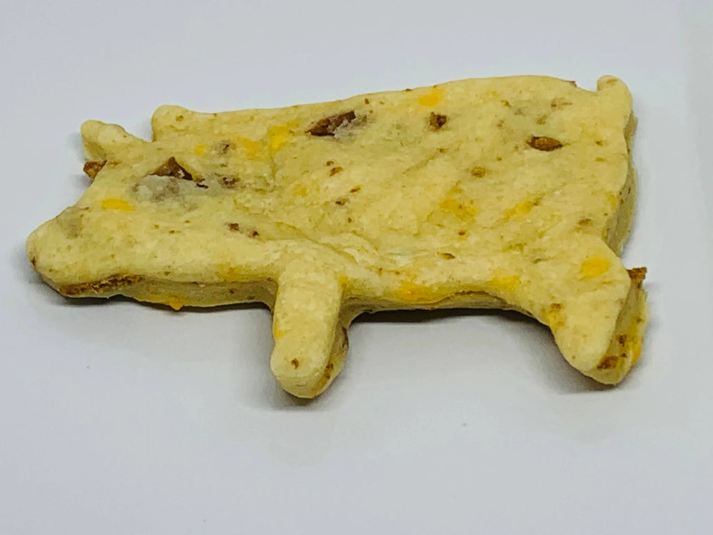 Gourmet pig-shaped dog treat from The Blue Cerebus Dog Bakery, part of The Famous Pig Cookie Dog Treats collection.