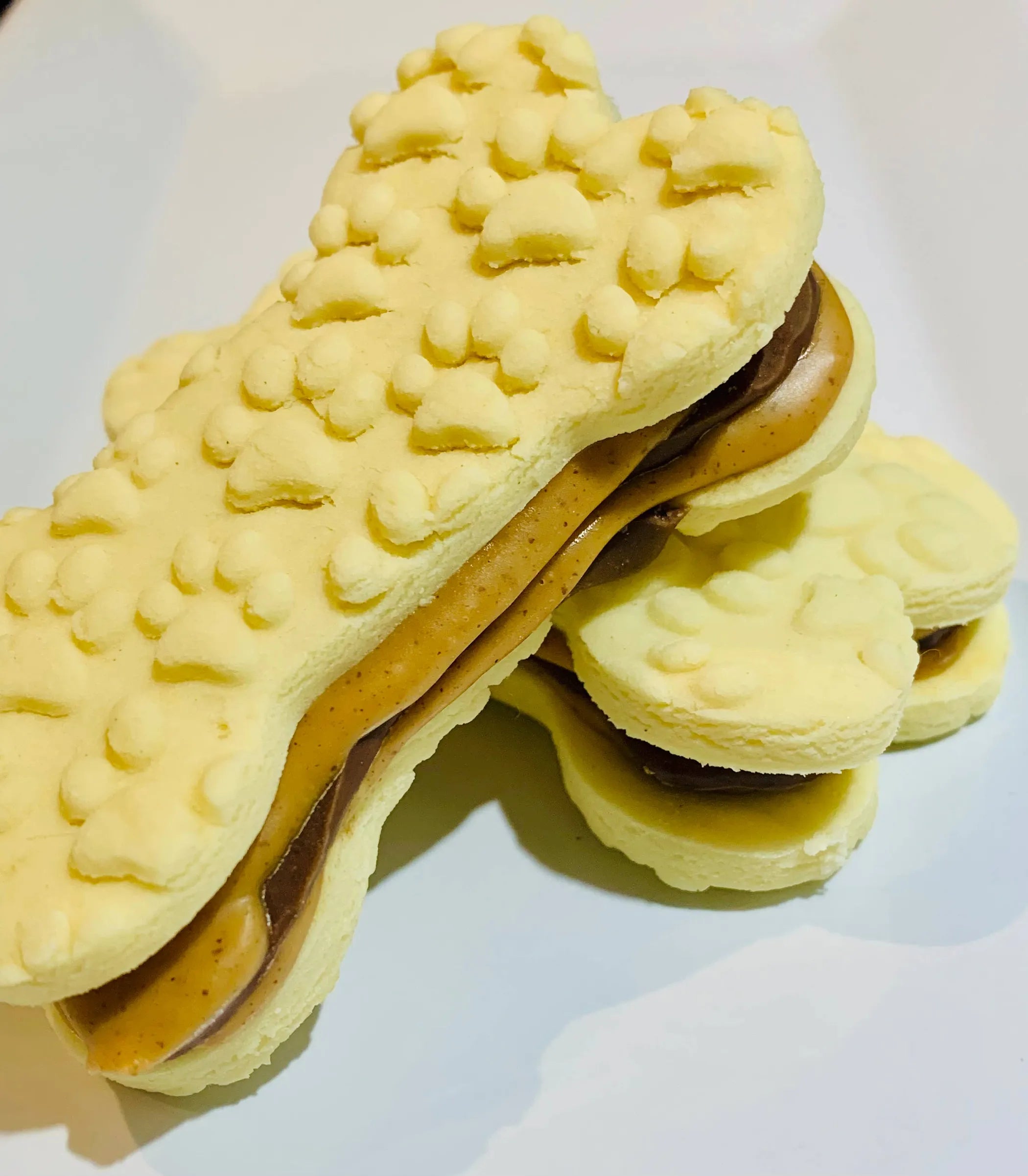 Dog treats called Sammies from The Blue Cerebus Dog Bakery, showing a bag of tasty, natural dog treats in bright packaging.