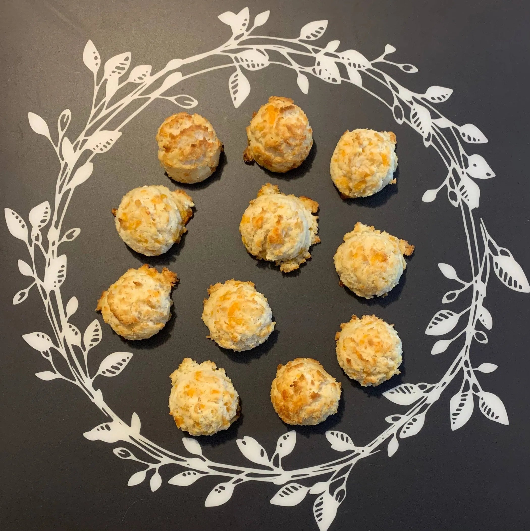 Southern Cheddar Bark'scuit dog treats by The Blue Cerebus Dog Bakery, gourmet cheese snacks for dogs, shown in a close-up image.