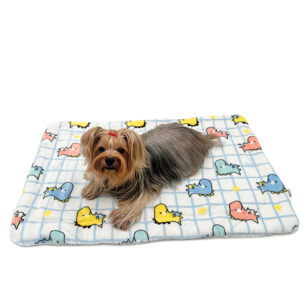 Colorful dinosaur-themed dog blanket from Klippo Pet Inc, featuring plush fabric and vibrant dinosaur prints.