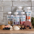 Five-pack of Bark Pouch lickable dog treats in colorful packaging, designed for dogs to enjoy tasty, chewable treats.