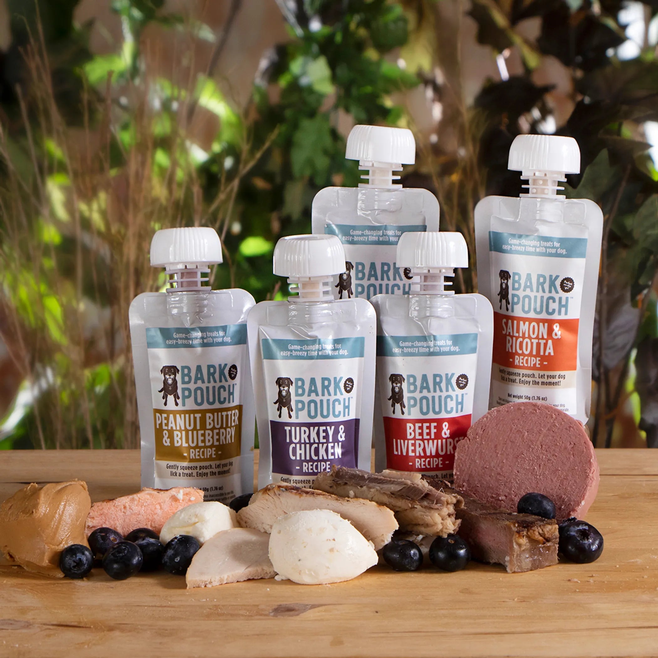 Five-pack of Bark Pouch lickable dog treats in colorful packaging, designed for dogs to enjoy tasty, chewy rewards