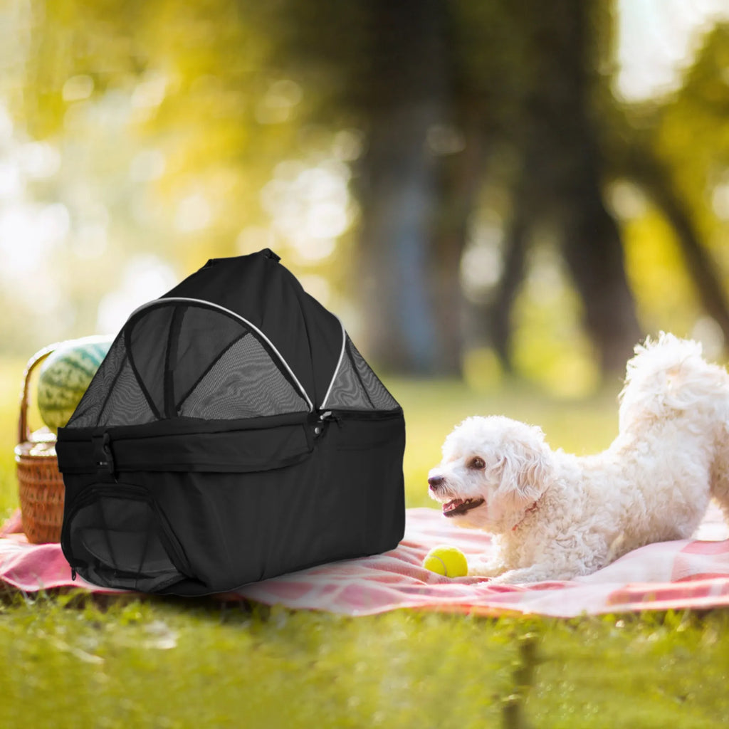Black foldable 4-wheel pet stroller by Linx Group, designed for travel with a comfortable carrier and easy mobility.