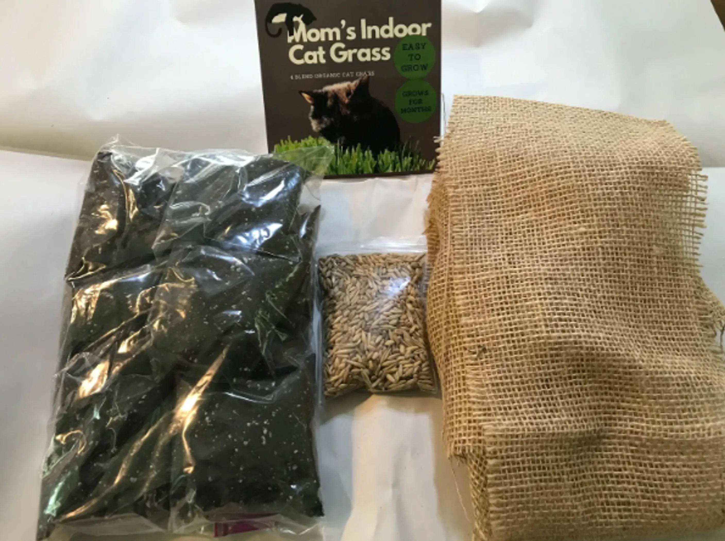 Mom's Indoor Cat pet tray refill package with colorful cat toy accessories for easy cleanup and interactive play.