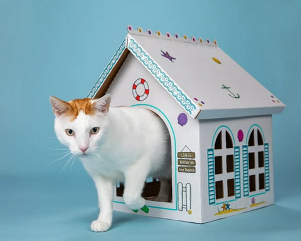 Set of five Cat in the Box Breezy Beach Cottage cardboard cat playhouses, featuring colorful beach-themed designs for feline fun.