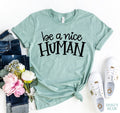 Dark gray Agate Be A Nice Human T-shirt with a casual fit, featuring a positive message on the front.