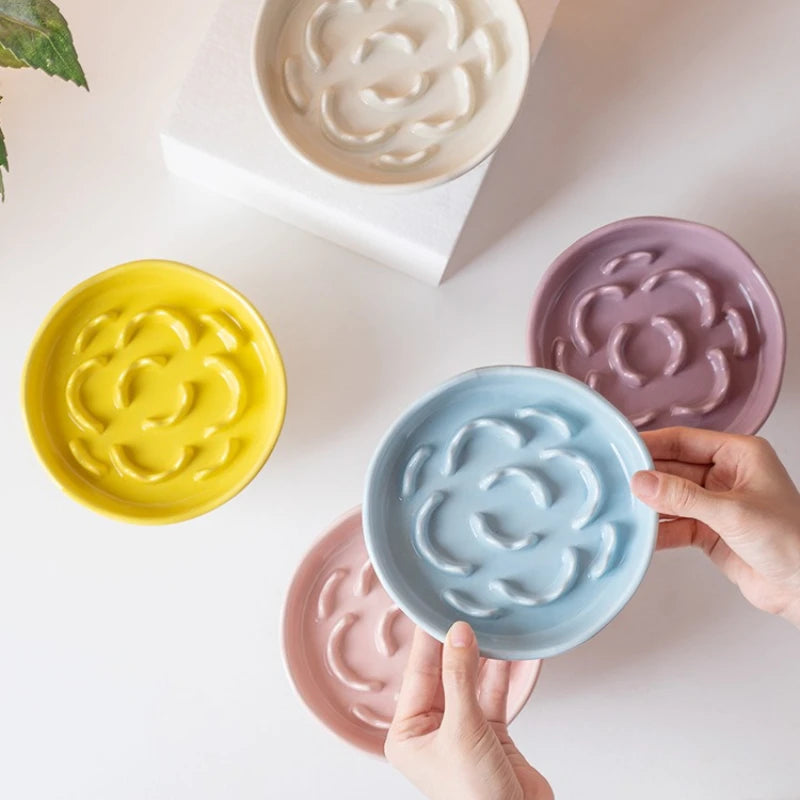White ceramic slow food cat bowl with high footed design and neck protection, ideal for preventing whisker fatigue.