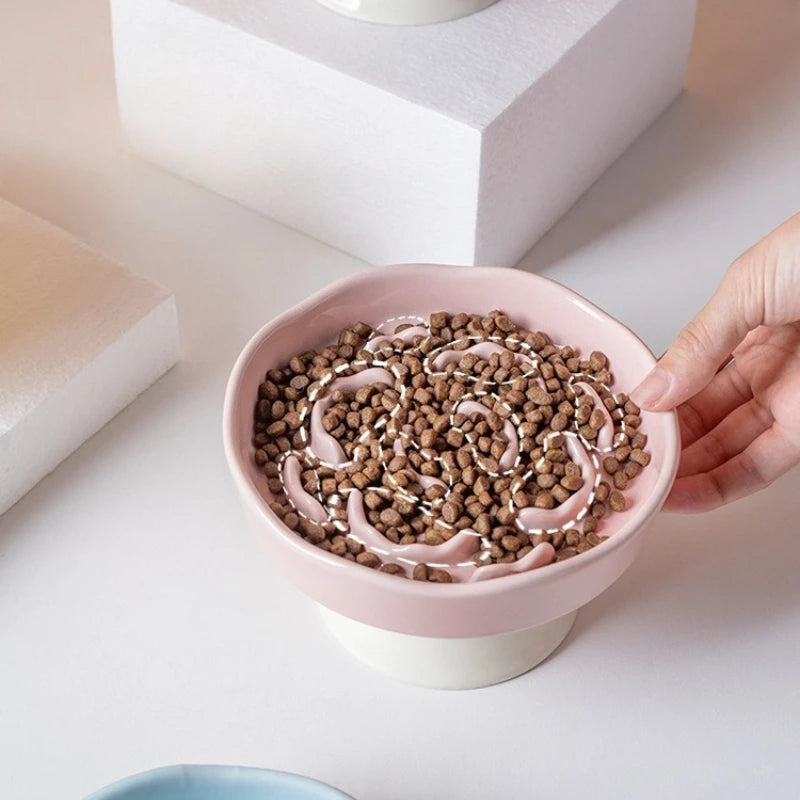 White ceramic slow food cat bowl with high footed design, neck protection, and sturdy structure for feeding comfort.
