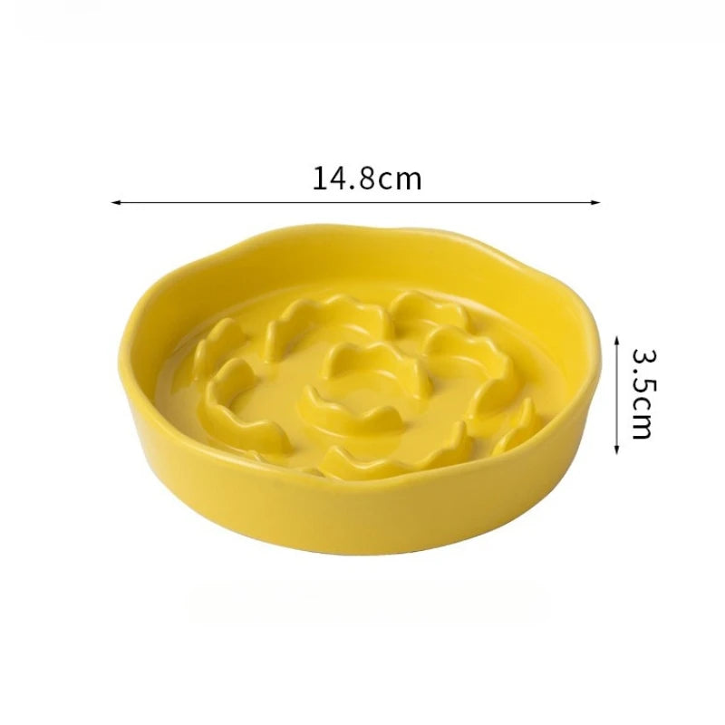 White ceramic slow food cat bowl with high footed design and neck protection for comfortable feeding.