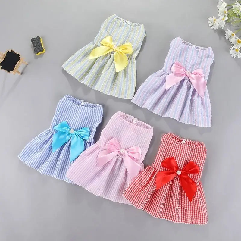 Small dog wearing purple flower princess dress, cute pet apparel for small dogs by AliExpress, featuring floral details and a tulle skirt.