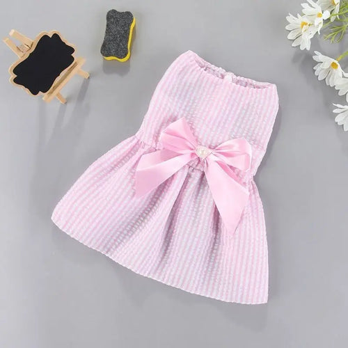 Small dog wearing purple flower princess dress, featuring a cute design for pets, by AliExpress dog apparel brand.