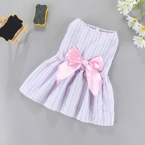 Small dog wearing a purple flower princess dress with bow details, perfect for cute pets and small breed dogs.