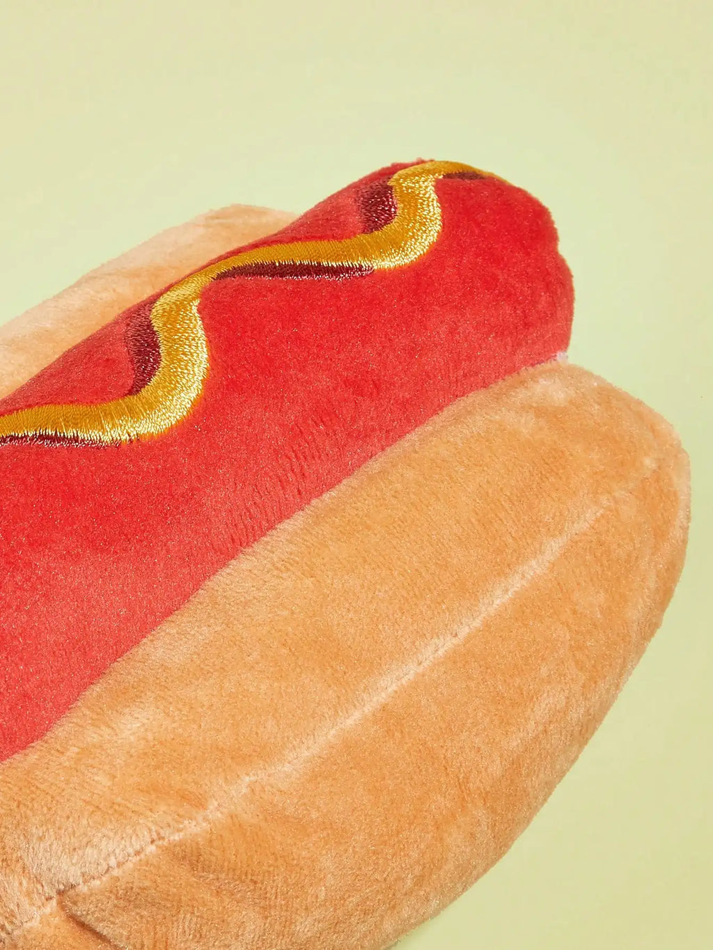 Yellow hot dog design dog toy with squeaky plush, durable chew for grinding teeth and playful pets.