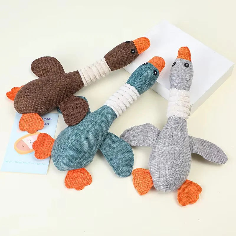 Gray eco-friendly plush duck dog toy with squeaker, perfect for chewing and play, by AliExpress.