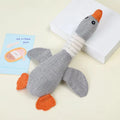 Gray plush duck dog toy with squeaker, eco-friendly and soft, designed for chewing and play for dogs.