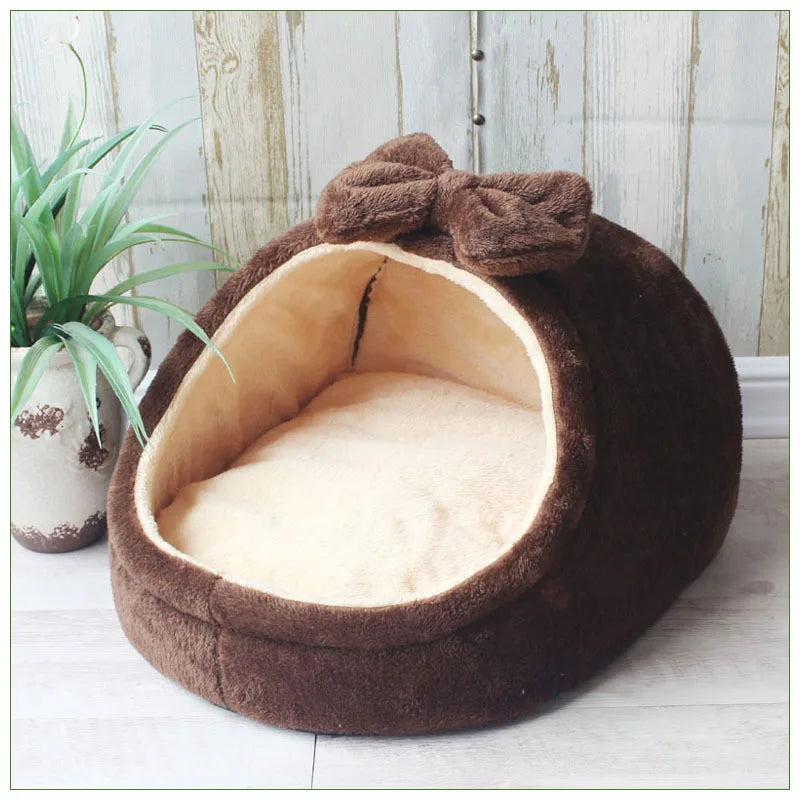 Soft cozy pet house bed for small dogs and cats, plush interior with rounded shape, ideal for comfortable sleeping.