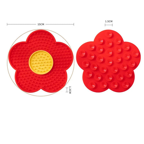 Red sunflower-shaped silicone pet licking pad for cats and dogs, designed as a slow feeder bowl for pet treats and food.