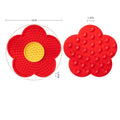 Red sunflower-shaped silicone pet licking pad for cats and dogs, designed as a slow feeder bowl for pet treats and food.
