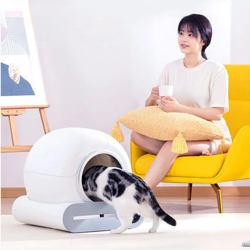 White automatic cat litter box from AliExpress with self-cleaning feature, designed for large cats, electric-powered pet litter box.