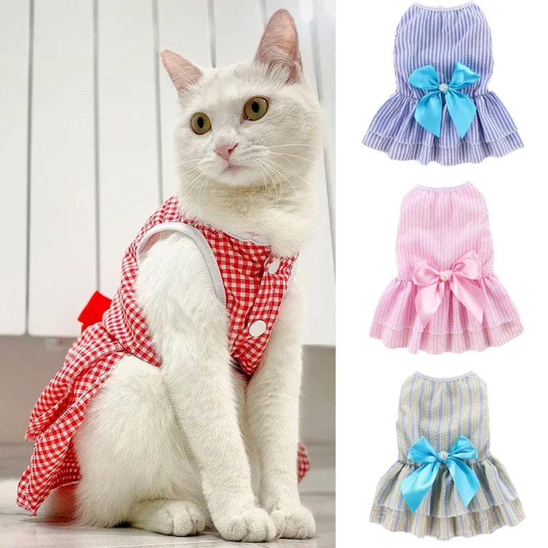 Pink summer pet dress for cats and puppies featuring striped plaid design and floral accents, ideal for stylish pet apparel.