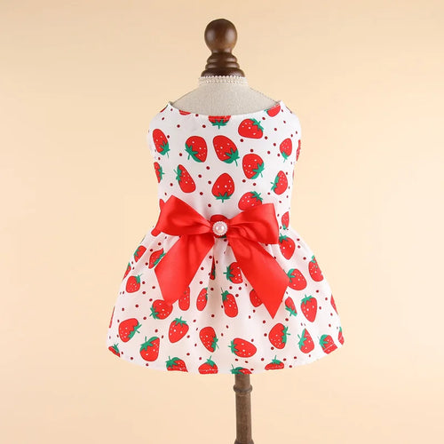 Pink summer pet dress for cats and puppies featuring striped plaid design and floral accents, ideal for stylish pet apparel.