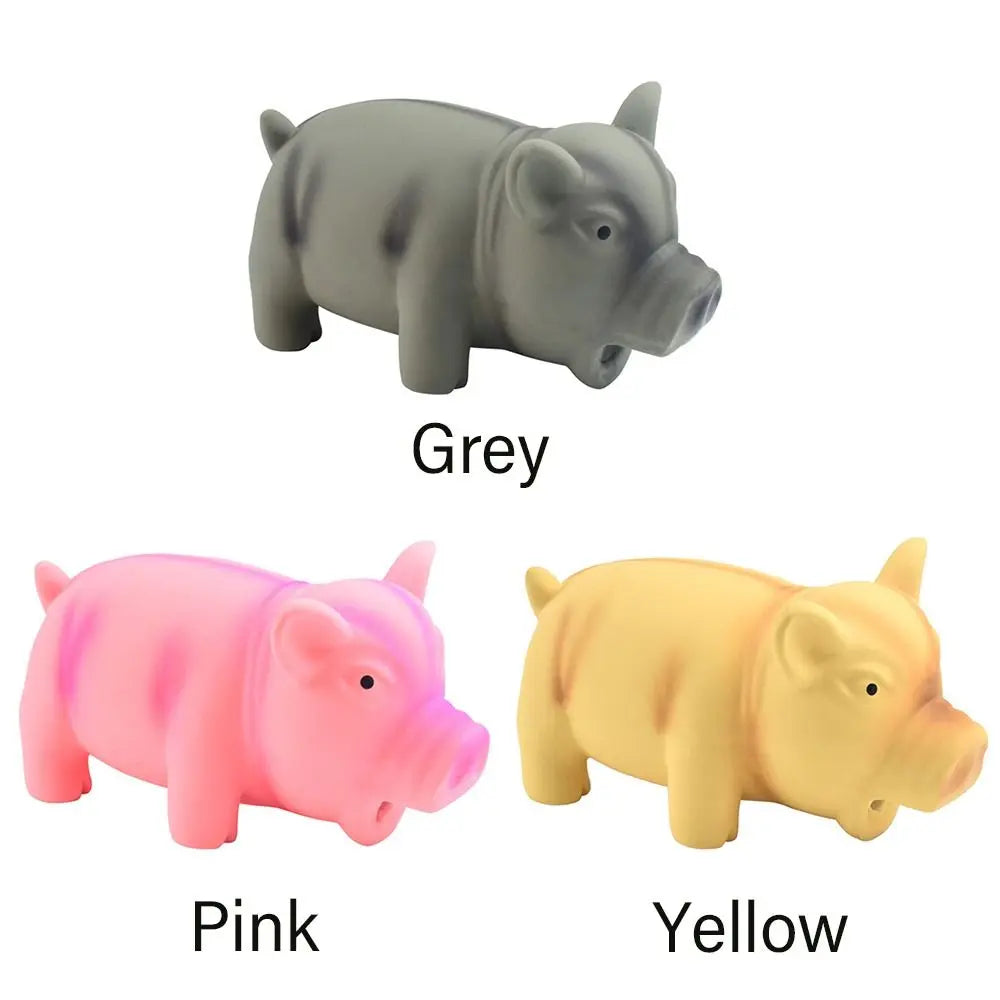 Yellow rubber pig squeak toy for dogs with grunting sound, made of latex, designed for pet chewing and play.
