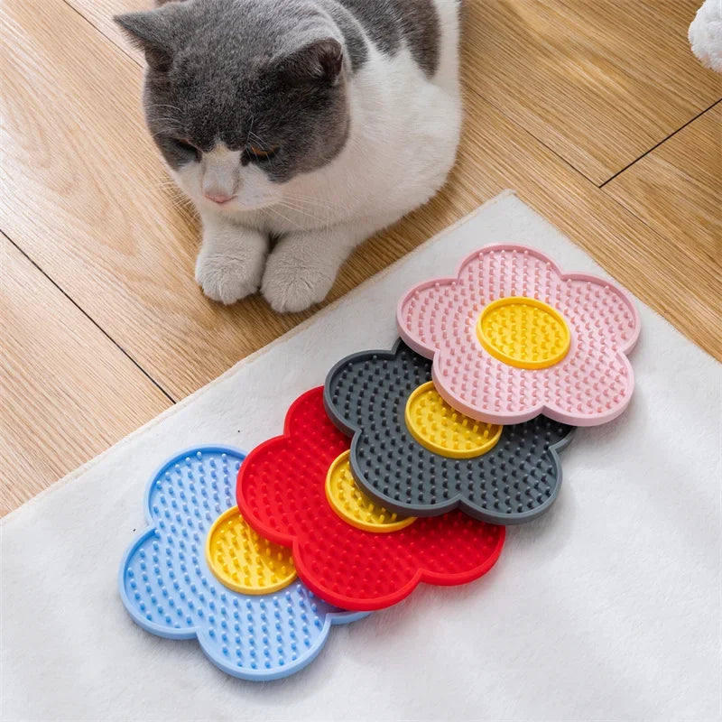 Blue silicone pet licking mat for dogs and cats, sunflower shape slow feeder bowl for calming and feeding.