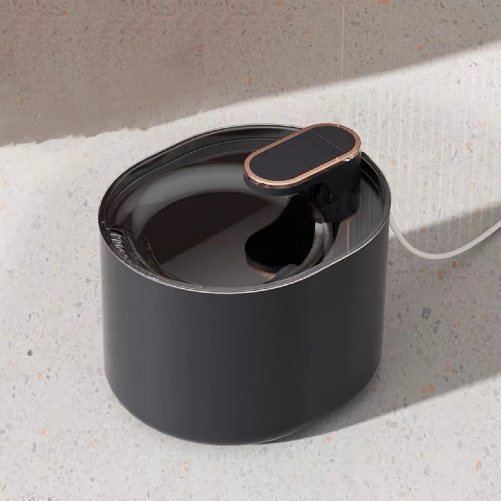 Black automatic pet water dispenser fountain for cats and dogs, mess-free spill-proof drinking bowl with no wet mouth.