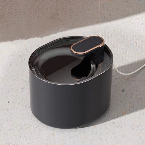 Black automatic pet water dispenser fountain for cats and dogs, mess-free spill-proof drinking bowl with no wet mouth.