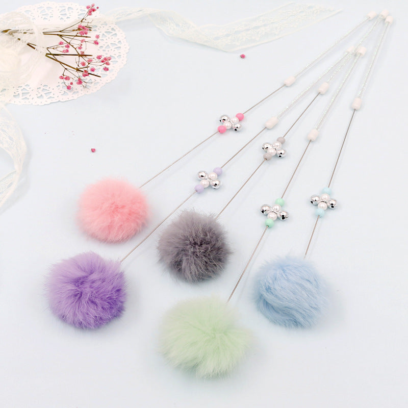Colorful pom pom cat teaser wand with bell toy from Brandywines Time, featuring a grey handle and vibrant pom poms for play.