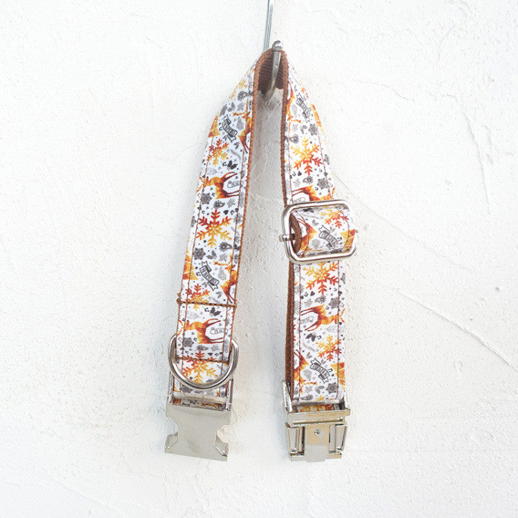 Handmade golden Christmas dog collar by MUTTCO featuring festive design, small size, and adjustable strap for a stylish pet accessory.