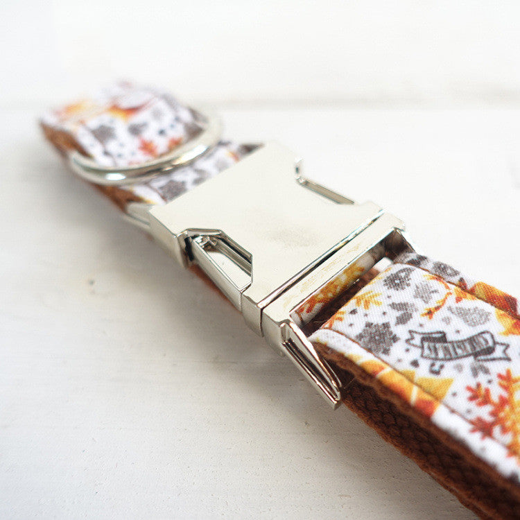 Handmade golden Christmas dog collar by MUTTCO, featuring festive design and adjustable fit for small dogs.