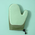 Green silicone massage gloves and pet hair removal brushes from Brandywines Time, ideal for grooming pets and removing hair.
