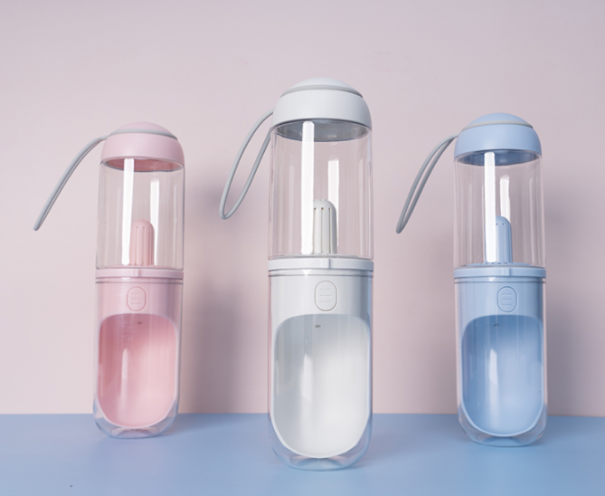 Lilac Milo outdoor travel pet water dispenser with pink bottle for dogs and cats, portable pet water bottle for on-the-go hydration.