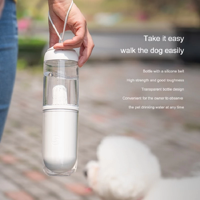 Pink outdoor travel pet water dispenser for dogs and cats by Lilac Milo, compact bottle with water reservoir for pets on the go.