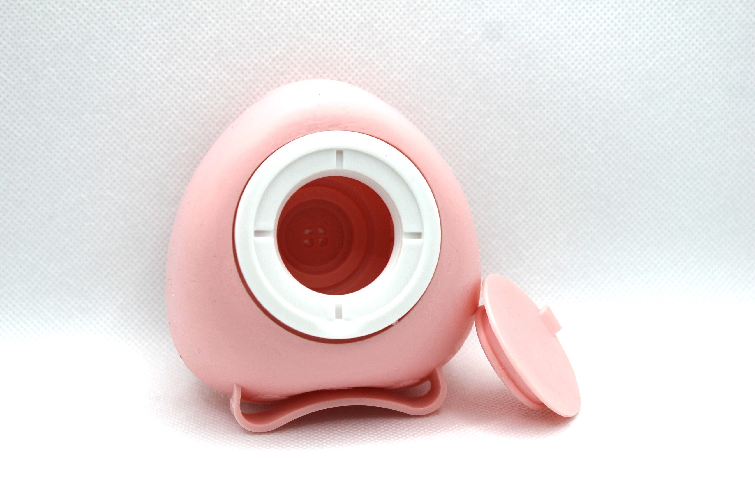 Pink BrushPro bath brush from Sky Pandion, pet grooming tool with ergonomic handle for easy and convenient bath time.