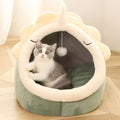 Yellow Pandora dinosaur-shaped pet bed with plush blankets and toy, cozy and fun for small pets.