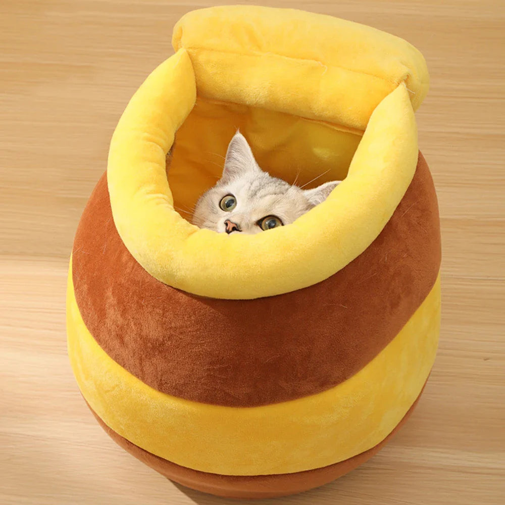 Yellow Pandora honey jar-themed cat bed with cozy, soft fabric, perfect for small pets to rest comfortably.